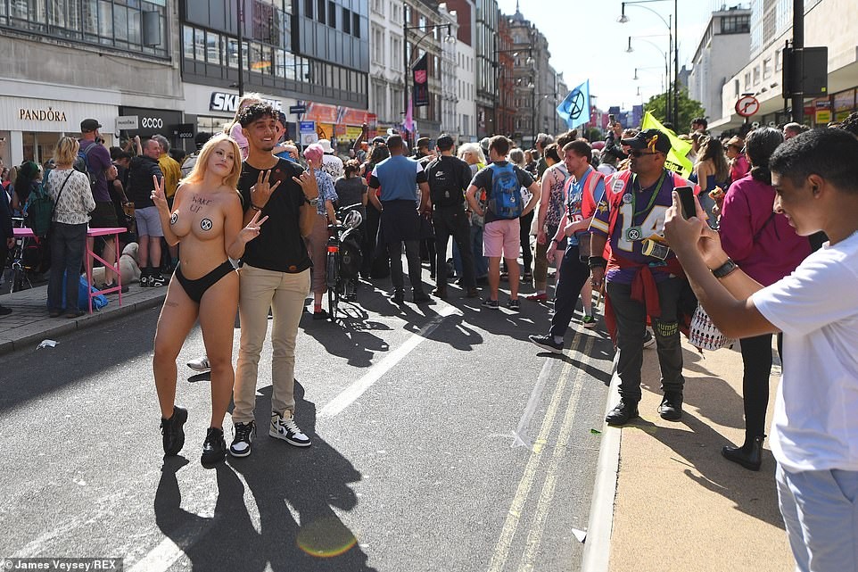 Click image for larger version

Name:	47091743-9925553-The_topless_demonstrator_is_joined_by_a_man_for_a_photograph_dur-a-38_1629910478363.jpg
Views:	106
Size:	231.5 KB
ID:	4179726